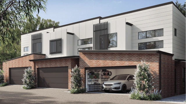 Modern two-storey residential townhouse with timber accents and a grey garage